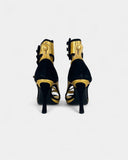 Sandales noires et dorées à talons