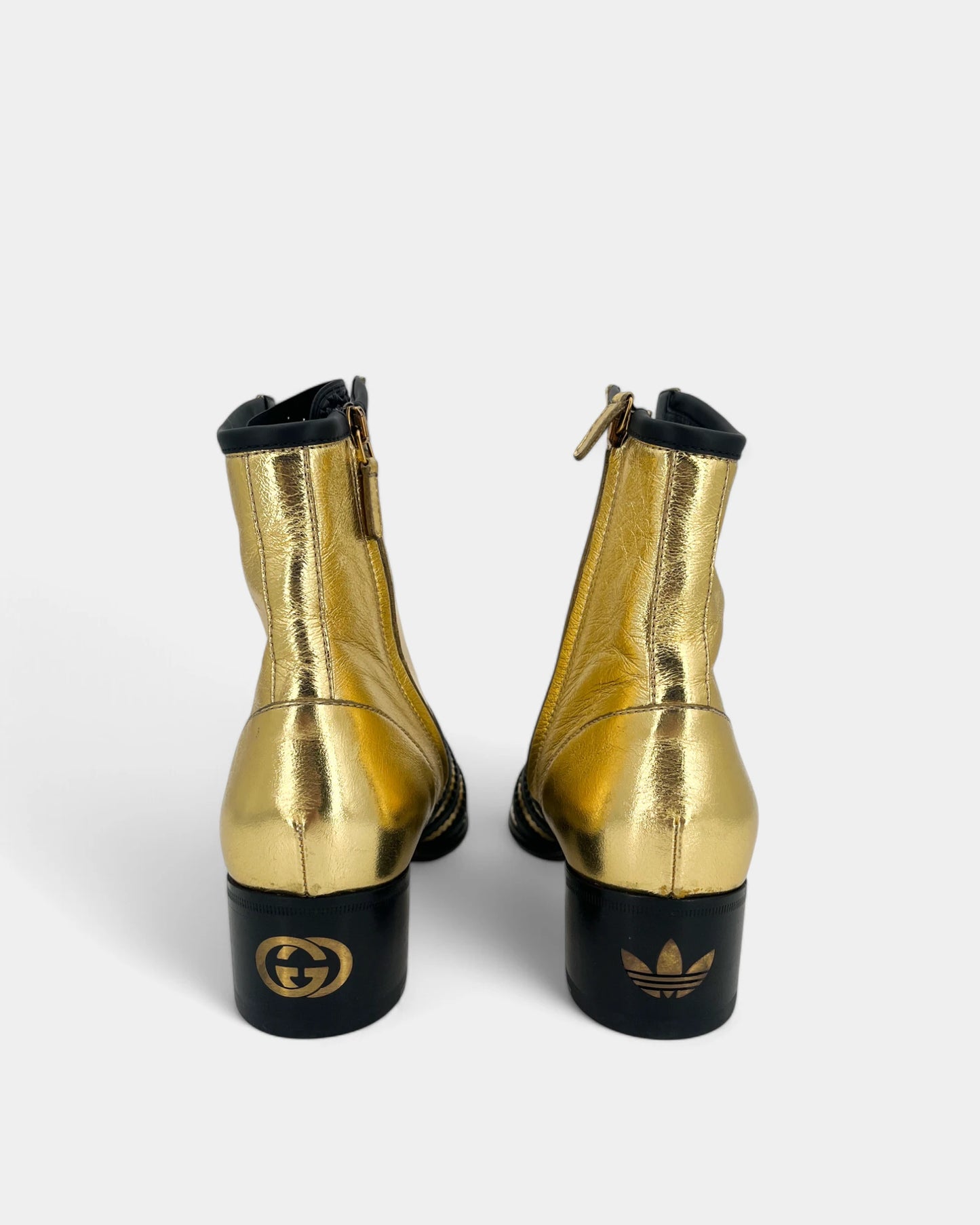 Gold and black ankle boots