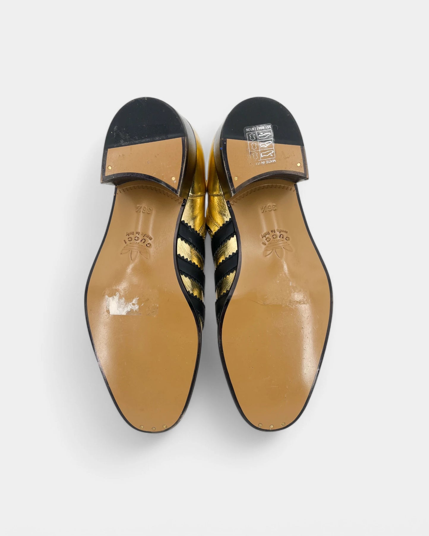 Gold and black ankle boots