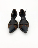 Brown and black pumps with a bow