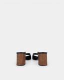 Mules noires à talon bois et boucle