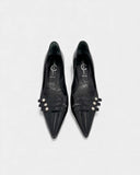 Black patent leather pumps