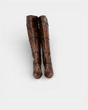 High boot in patinated brown leather