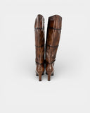 High boot in patinated brown leather