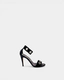 Sandales noires à œillets et talon aiguille