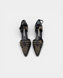 Escarpins vintage noirs à œillets dorés