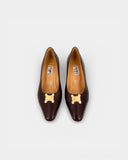 brown leather pumps