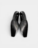 Black pumps with a bow