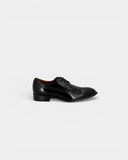 Black patent leather derbies