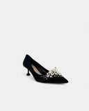 Black shoes adorned with pearls