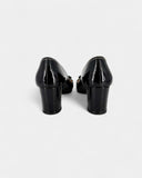 Black patent leather open-toe pumps