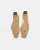 Cream-colored ballet flats with heels