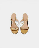 Sandales en cuir doré à talon sculptural