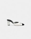 Black and white heeled mules