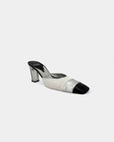 Black and white heeled mules