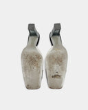 Black and white heeled mules