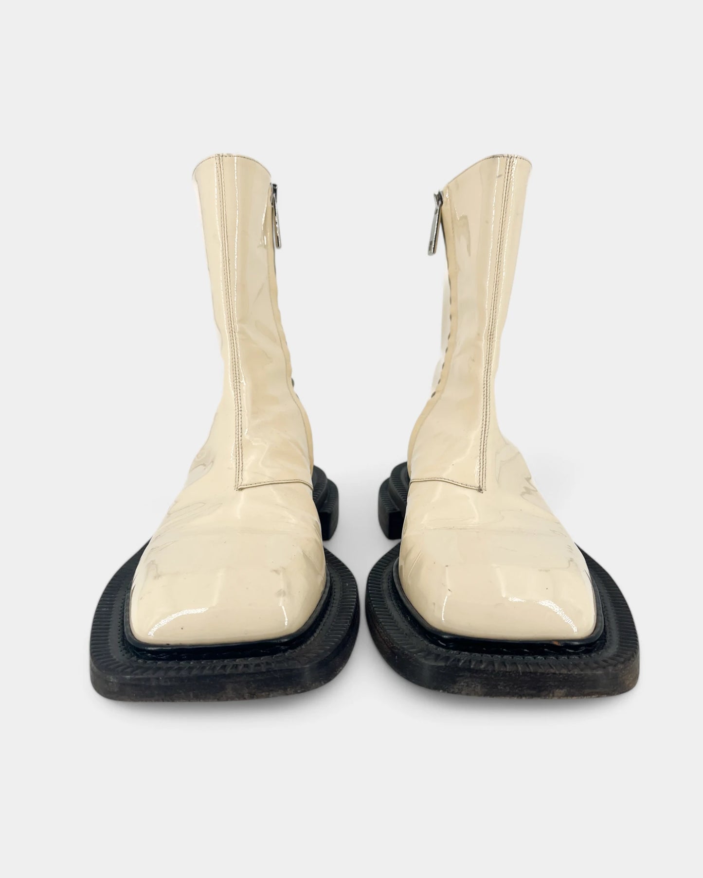 Cream boots with black soles