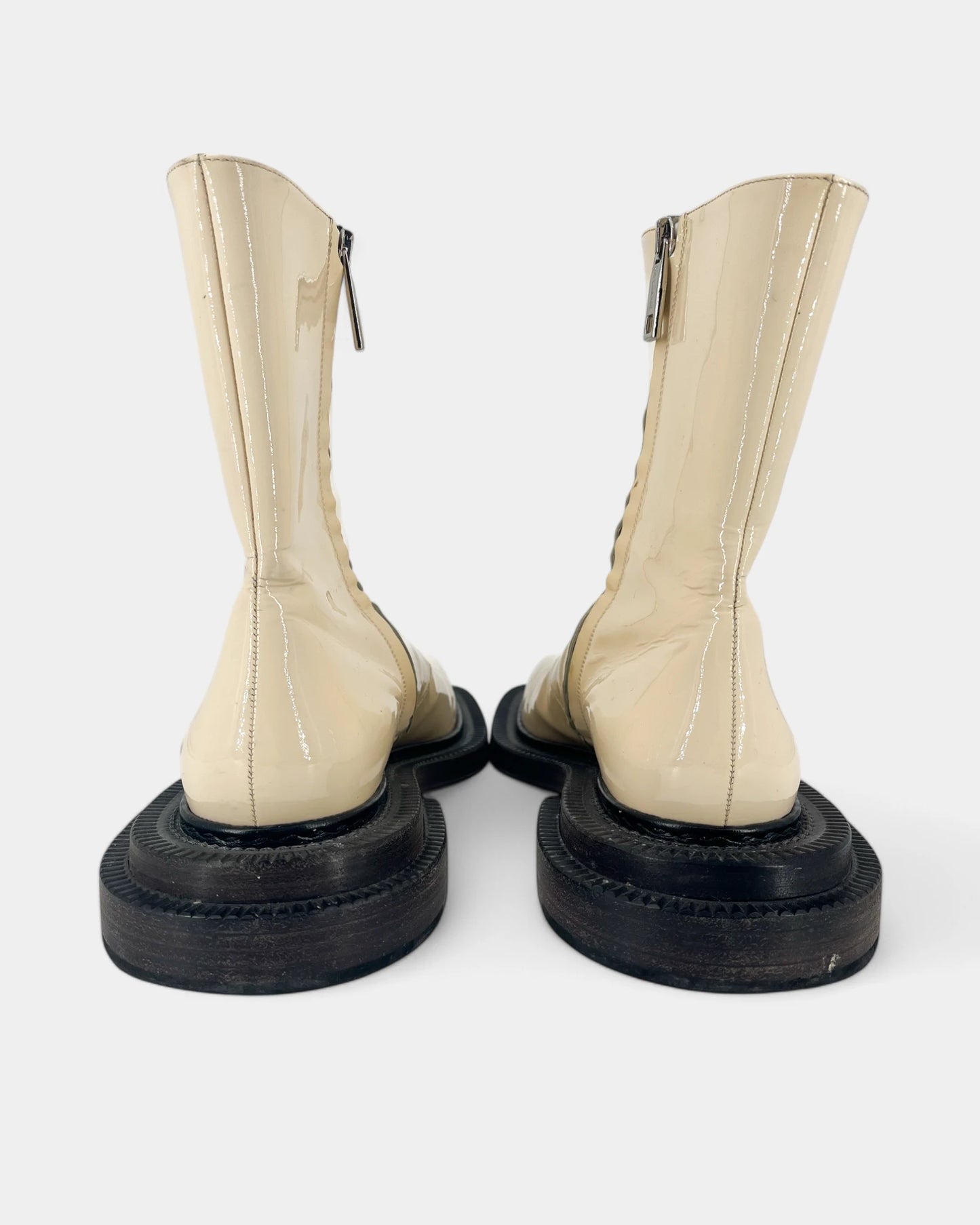 Cream boots with black soles