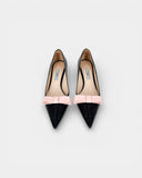 Black pumps with a pink bow
