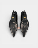 Black pumps with a pink bow