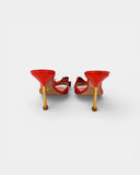 Coral patent leather mules with bow and rhinestones