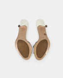 White heeled mules adorned with crystals