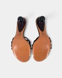 Brown flip-flops with sculptural heels