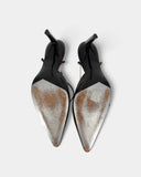 Brown pumps with a gold chain