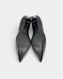 Black patent leather pumps