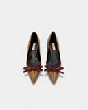 Brown patent leather pumps with burgundy bow