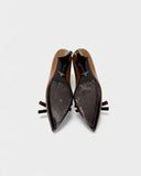 Brown patent leather pumps with burgundy bow