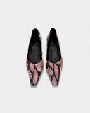 Pink pumps with a reptile print