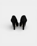 Textured black heeled pumps