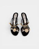 Black satin heeled sandals adorned with crystals