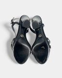 Black sandals with plexiglass heels