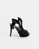 Black sandals with sculptural heel and pearl