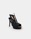 Black sandals with sculptural heel and pearl