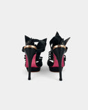 Black sandals with sculptural heel and pearl