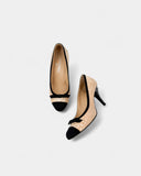 Beige leather and black fabric pumps