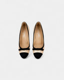 Beige leather and black fabric pumps